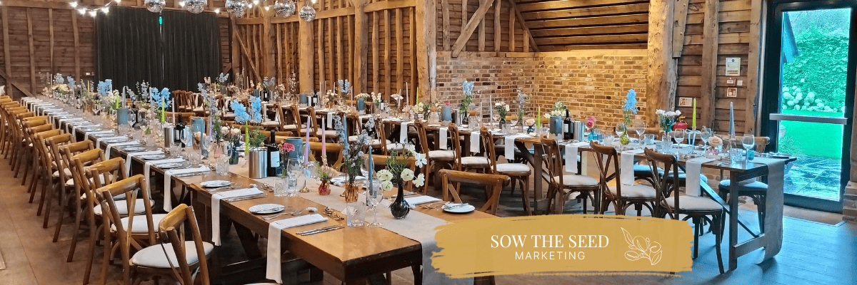Wedding venue marketing, barn interior set out for a wedding breakfast